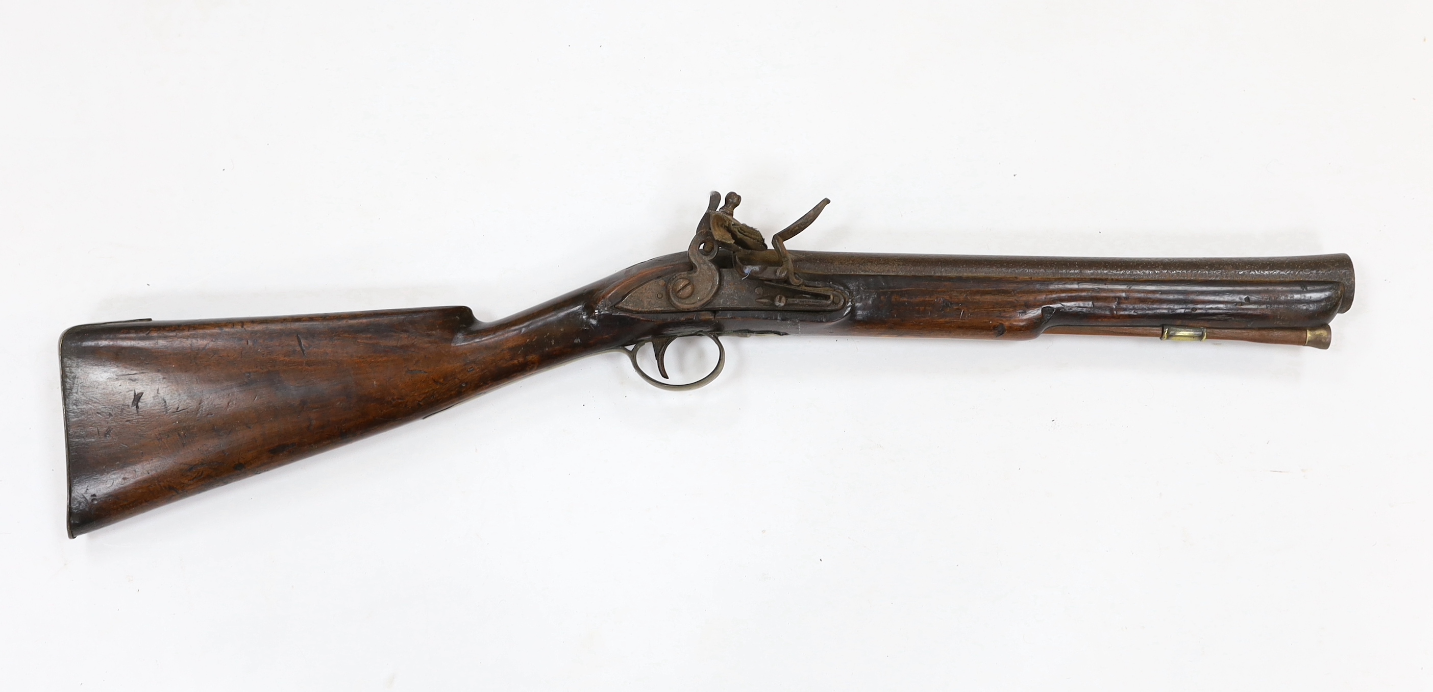 A flintlock blunderbuss fitted with a regulation British military service lock, stamped with tower and crown, GR civilian brass mounts, full stocked with wooden ramrod, barrel 36.5cm